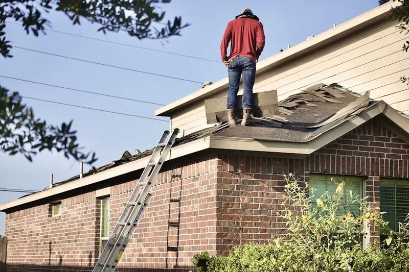Professional roofer working on a residential roof in Orangecrest